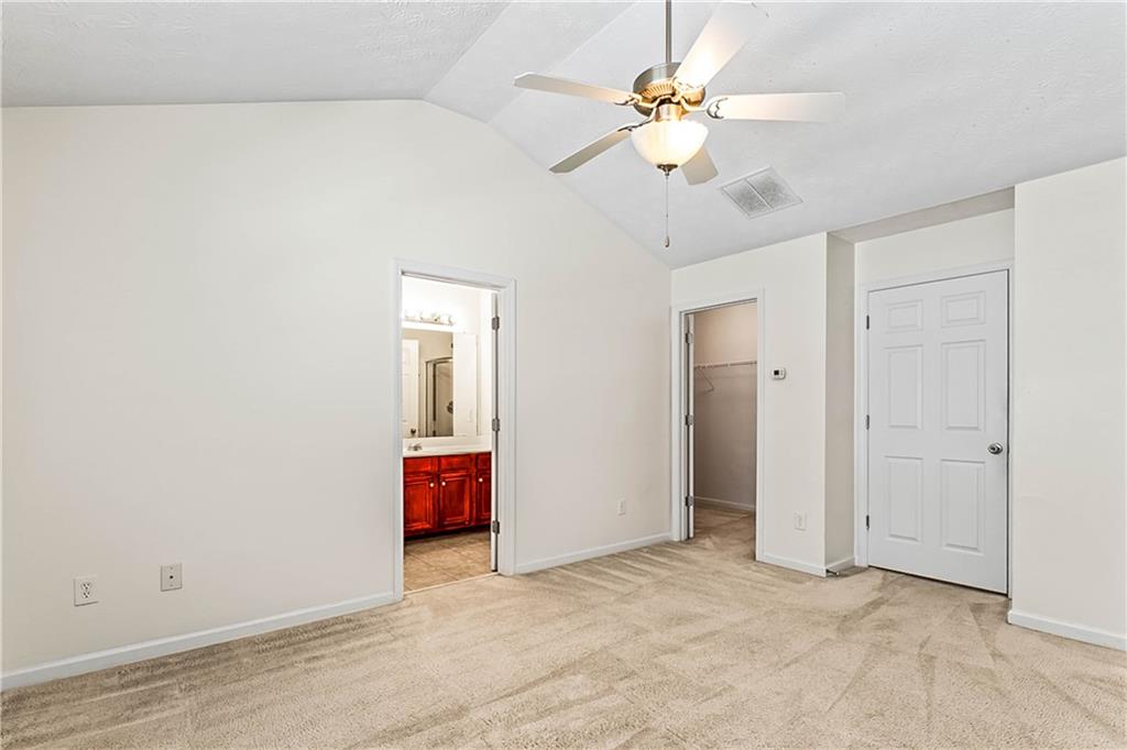 2555 Flat Shoals Road, Unit 2006 Atlanta, GA 30349 - Photo 23 of 29 a view of an empty room with chandelier fan