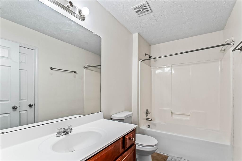 2555 Flat Shoals Road, Unit 2006 Atlanta, GA 30349 - Photo 26 of 29 a bathroom with a sink and a toilet
