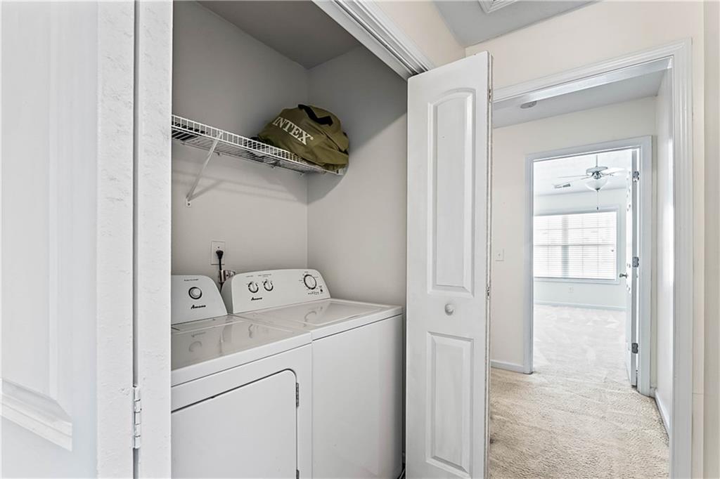 2555 Flat Shoals Road, Unit 2006 Atlanta, GA 30349 - Photo 27 of 29 a utility room with dryer and washer