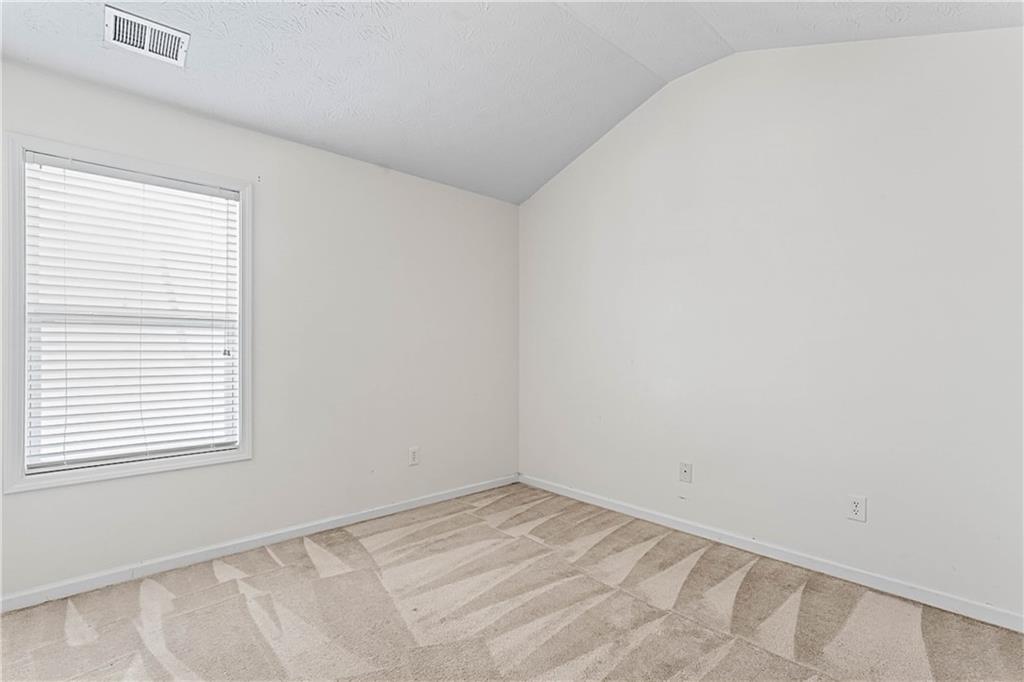 2555 Flat Shoals Road, Unit 2006 Atlanta, GA 30349 - Photo 28 of 29 an empty room with a window