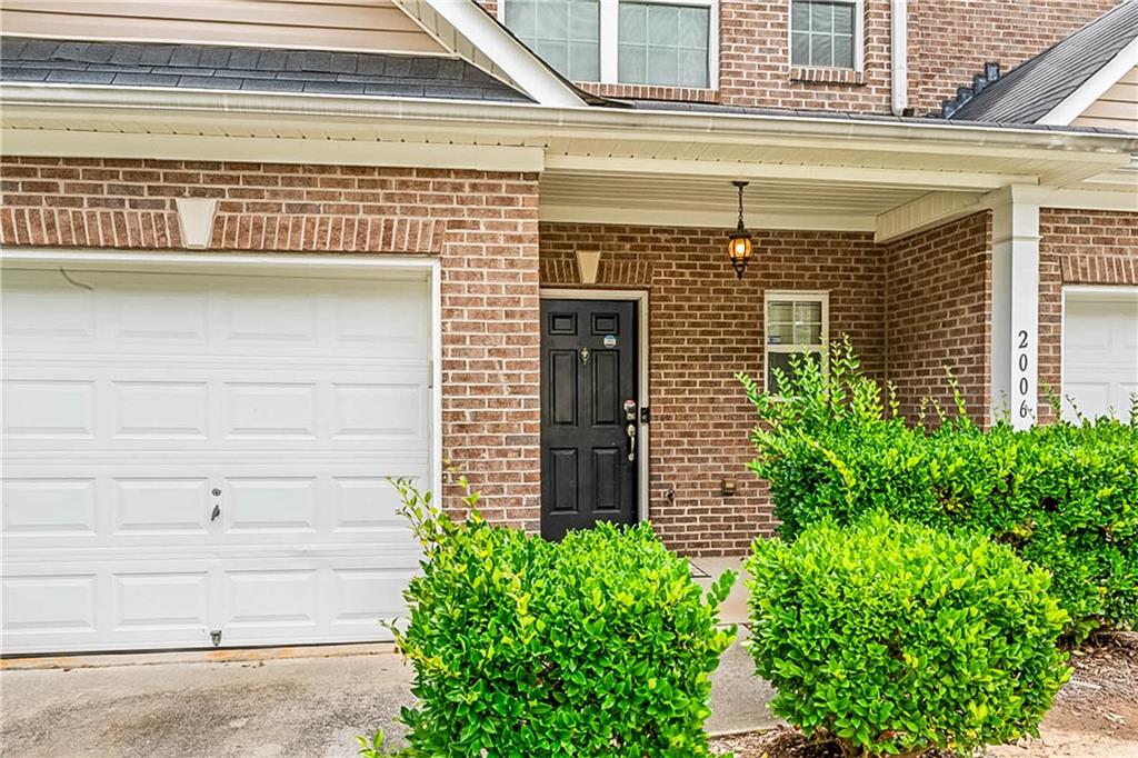 2555 Flat Shoals Road, Unit 2006 Atlanta, GA 30349 - Photo 3 of 29 front view of a house