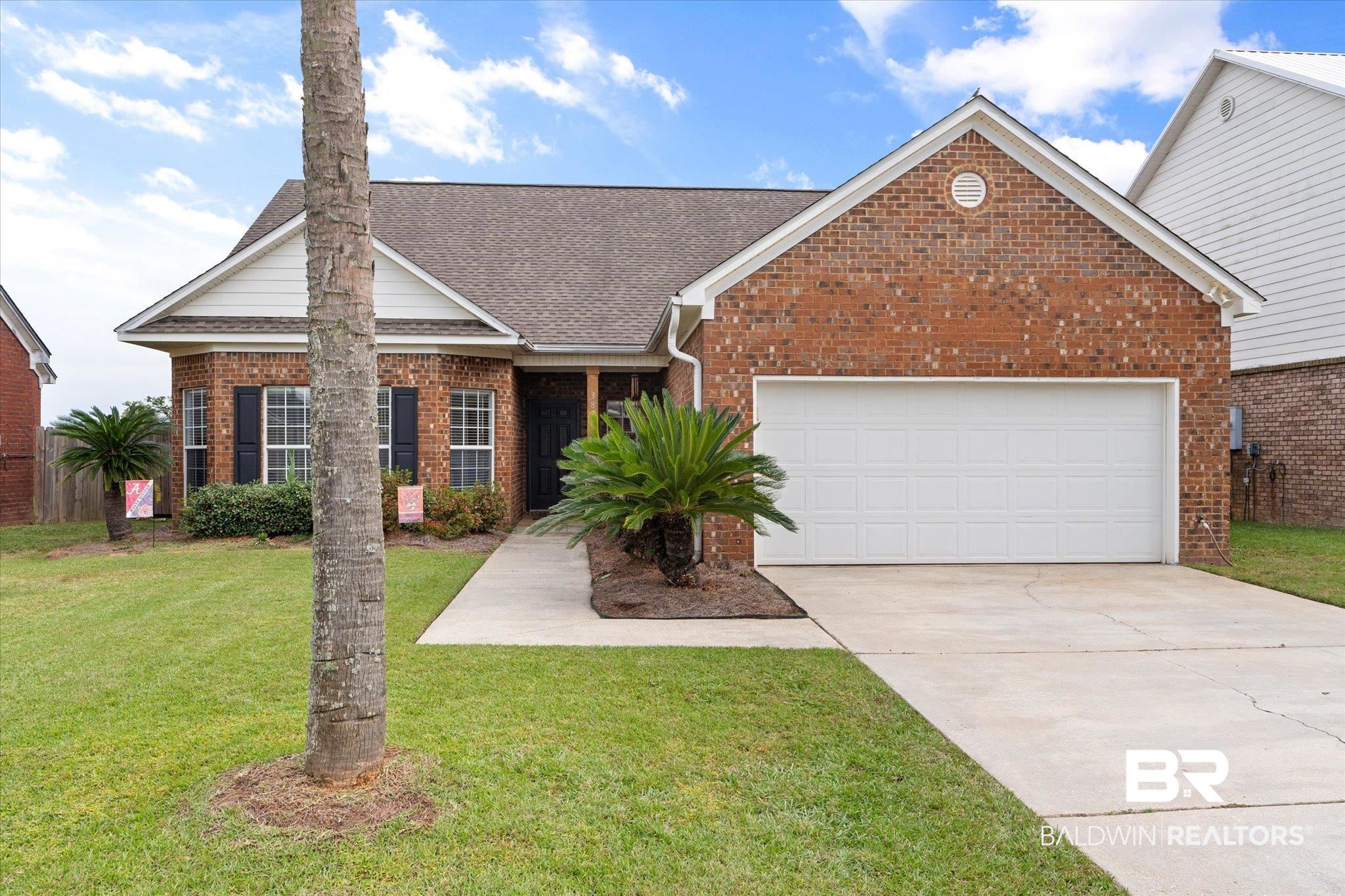 3876 Emerille Drive Foley, AL 36535 - Photo 29 of 31 View of front of property with a garage and a front yard