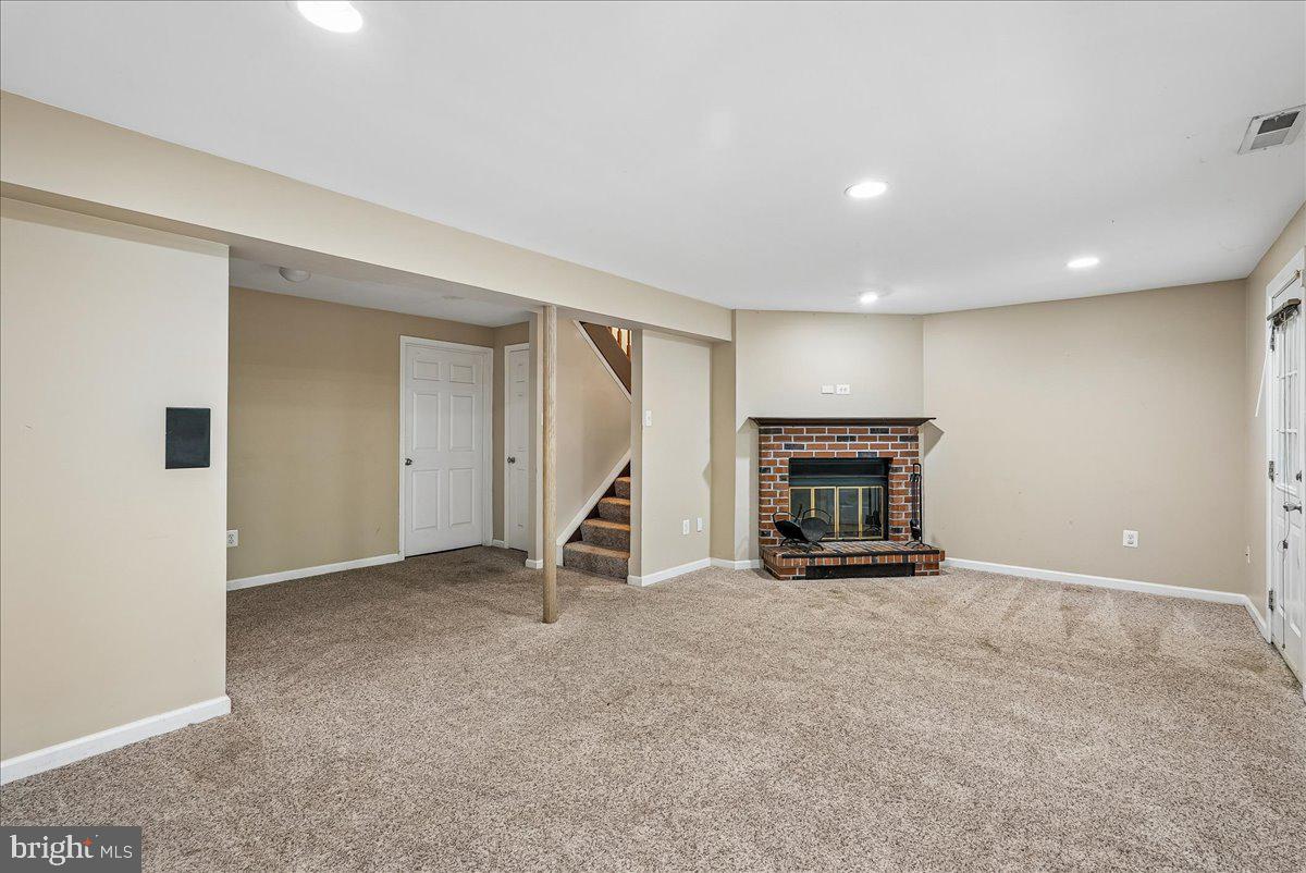 2331 Middle Creek Lane Reston, VA 20191 - Photo 43 of 78 a view of an empty room with a fireplace