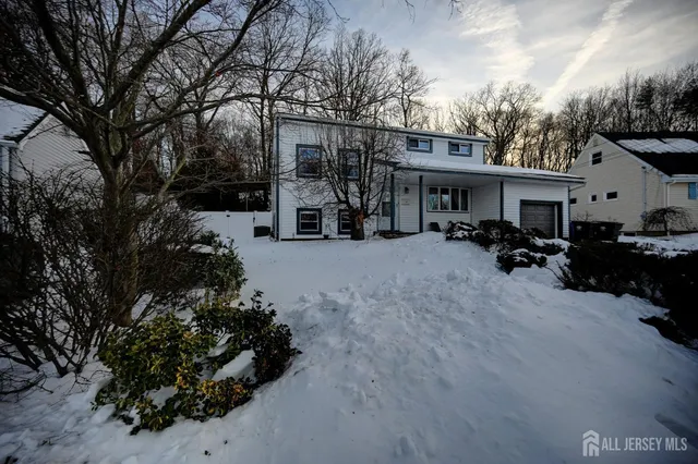 a view of deck in front of house with trees