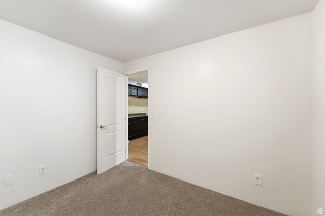 7235 Viansa Court Midvale, UT 84047 - Photo 33 of 43 Unfurnished room featuring light colored carpet