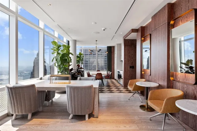 a dining room with a table and chairs