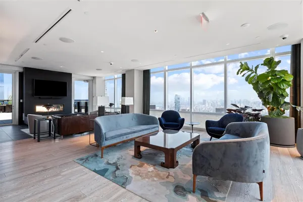 a terrace with outdoor seating and city view