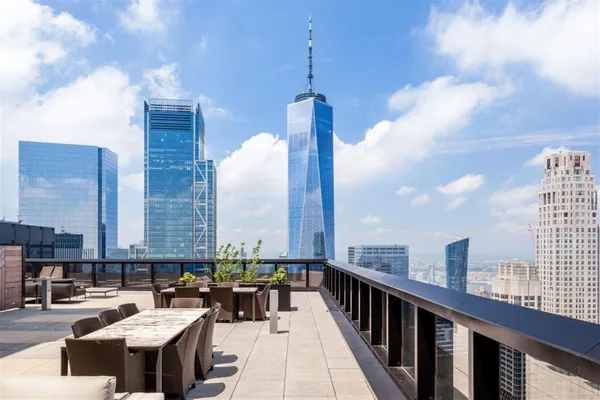 a view of roof deck with seating space and appliances