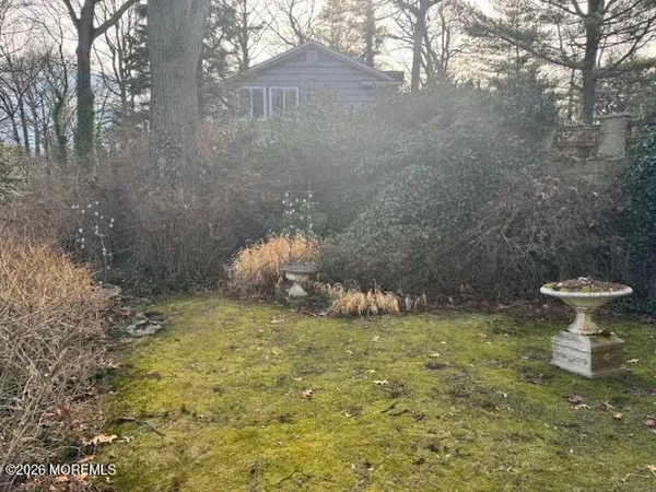 a view of tree in front of a house