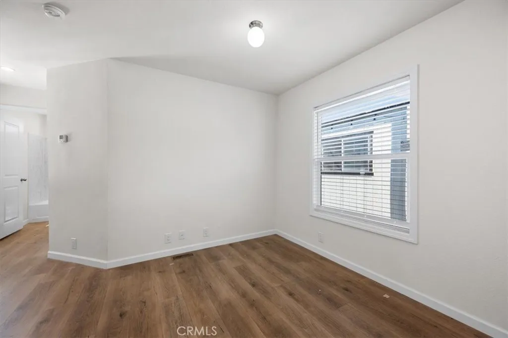 1255 Orcutt Road, Unit B27 San Luis Obispo, CA 93401 - Photo 12 of 24 an empty room with wooden floor and windows