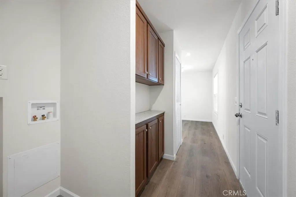 1255 Orcutt Road, Unit B27 San Luis Obispo, CA 93401 - Photo 18 of 24 a view of a hallway with wooden floor and staircase