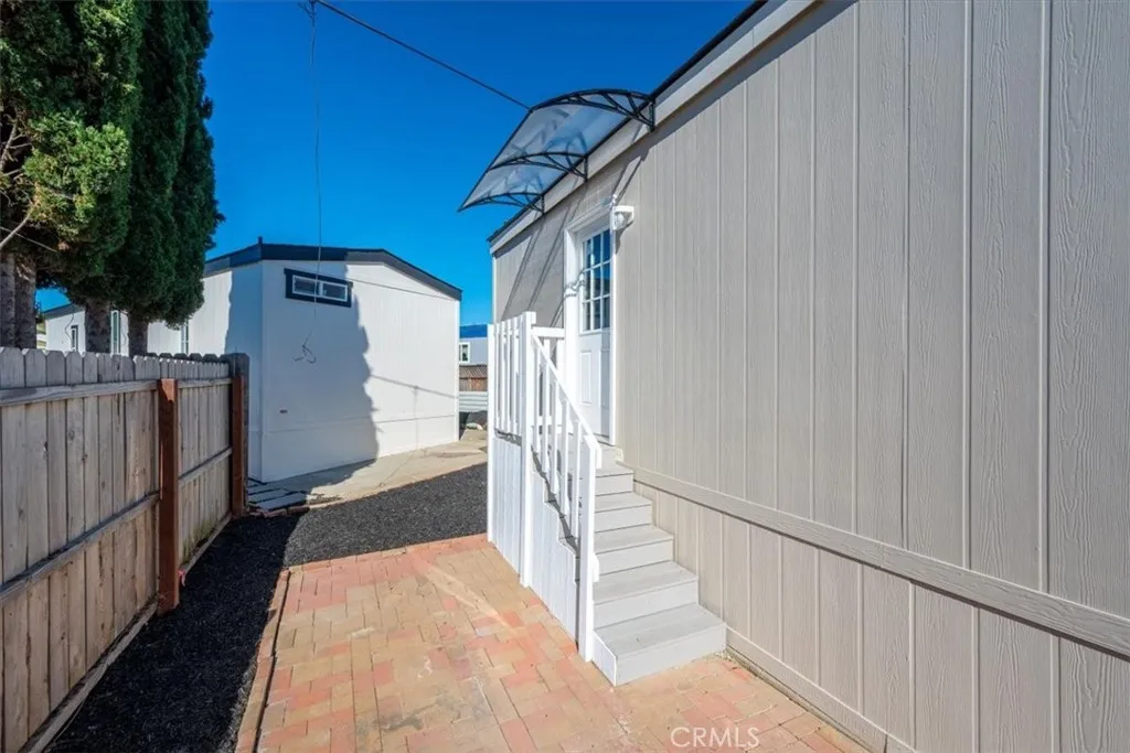 1255 Orcutt Road, Unit B27 San Luis Obispo, CA 93401 - Photo 7 of 24 a view of a house with wooden fence