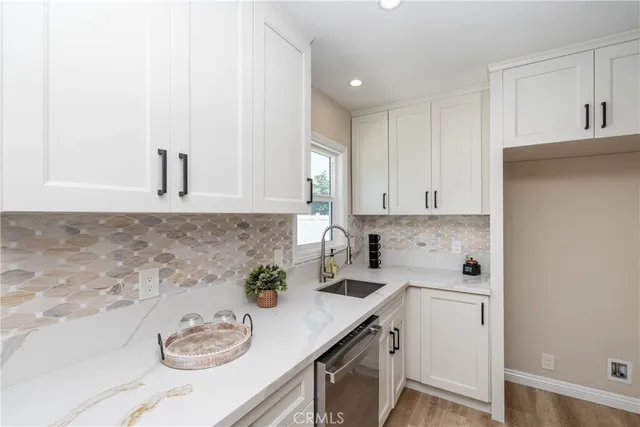 a view of a kitchen counter space and stainless steel appliances