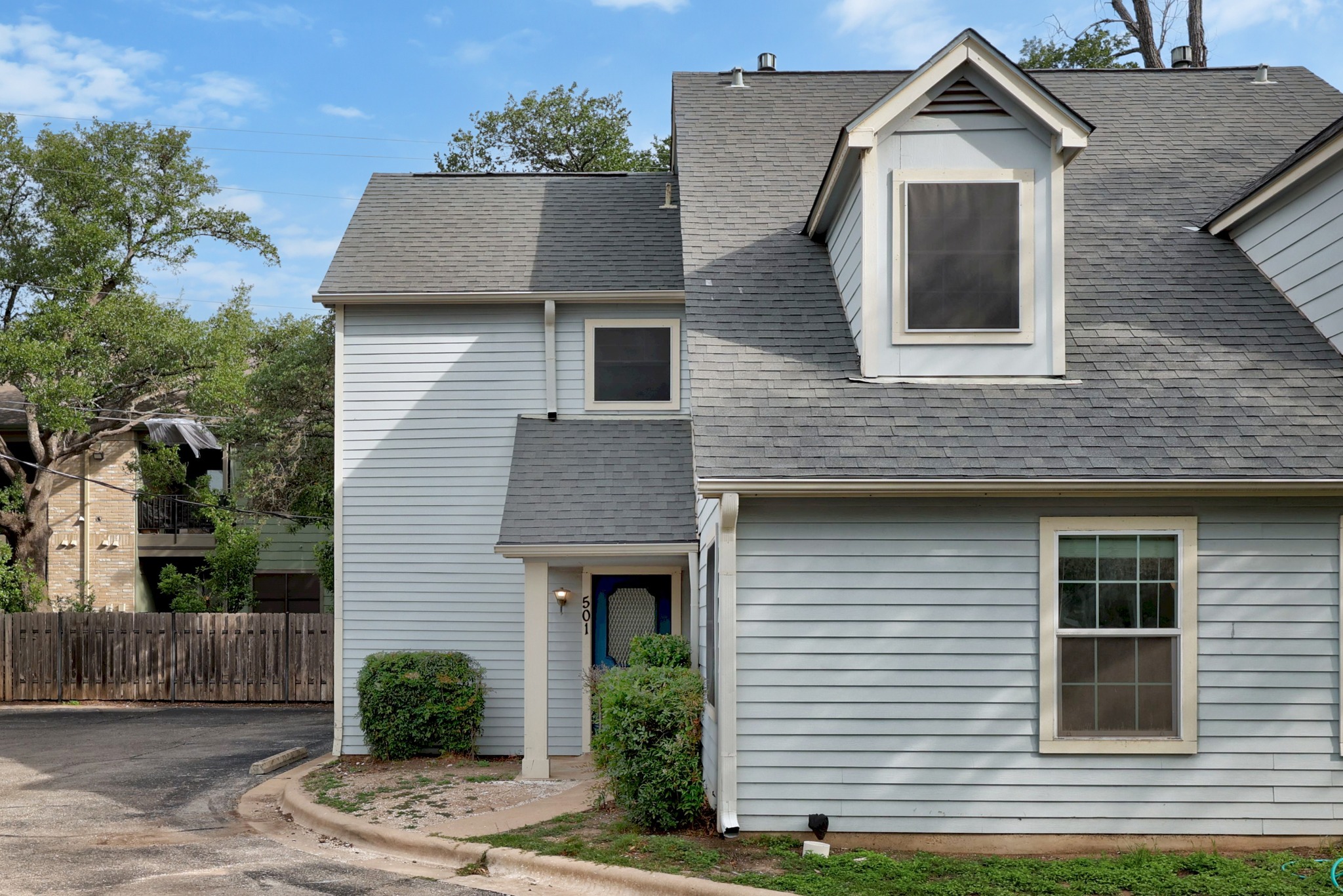 8330 Fathom Circle, Unit 501 Austin, TX 78750 - Photo 23 of 26 a front view of a house with a yard