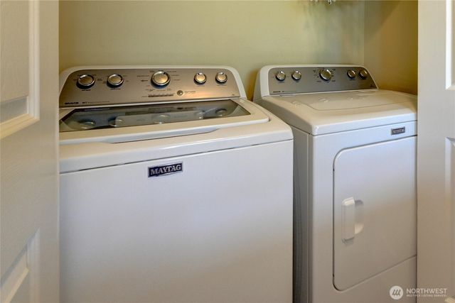 a bedroom with a bed and a desk