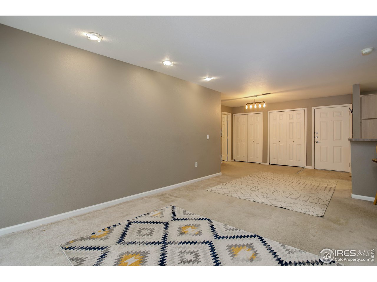 2510 Taft Drive, Unit 312 Boulder, CO 80302 - Photo 19 of 28 Living area, looking towards the front door and dining area.