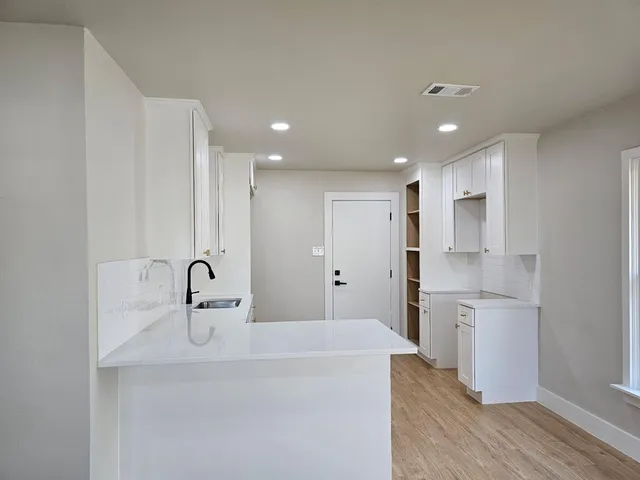 a bathroom with a sink tub and shower