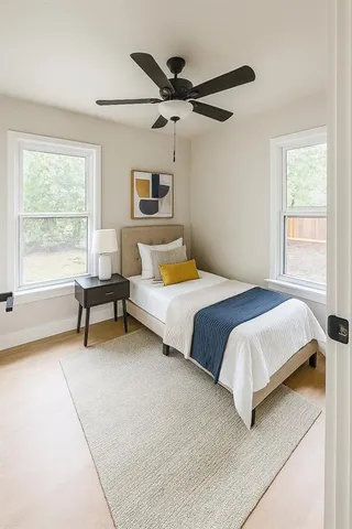 a bedroom with a bed and a window