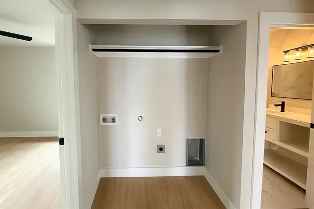 a view of walk in closet with empty racks