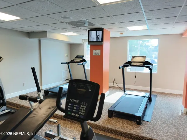 a view of workspace with furniture and window