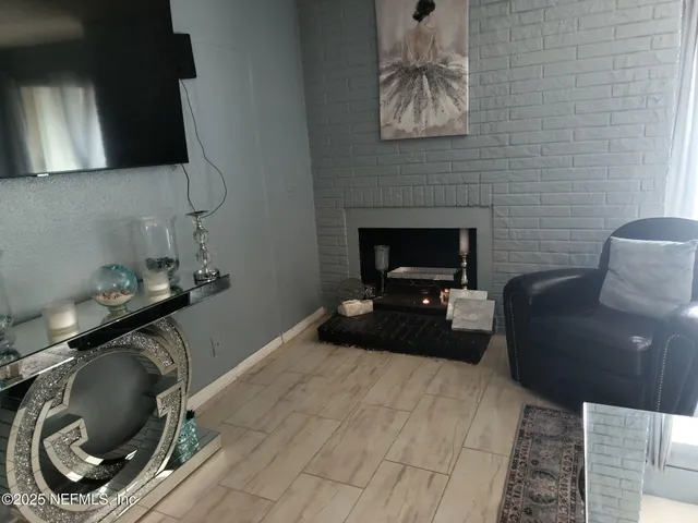 a bedroom with a bed and a fireplace