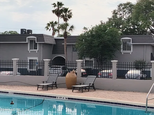 a view of a chairs and table in the patio