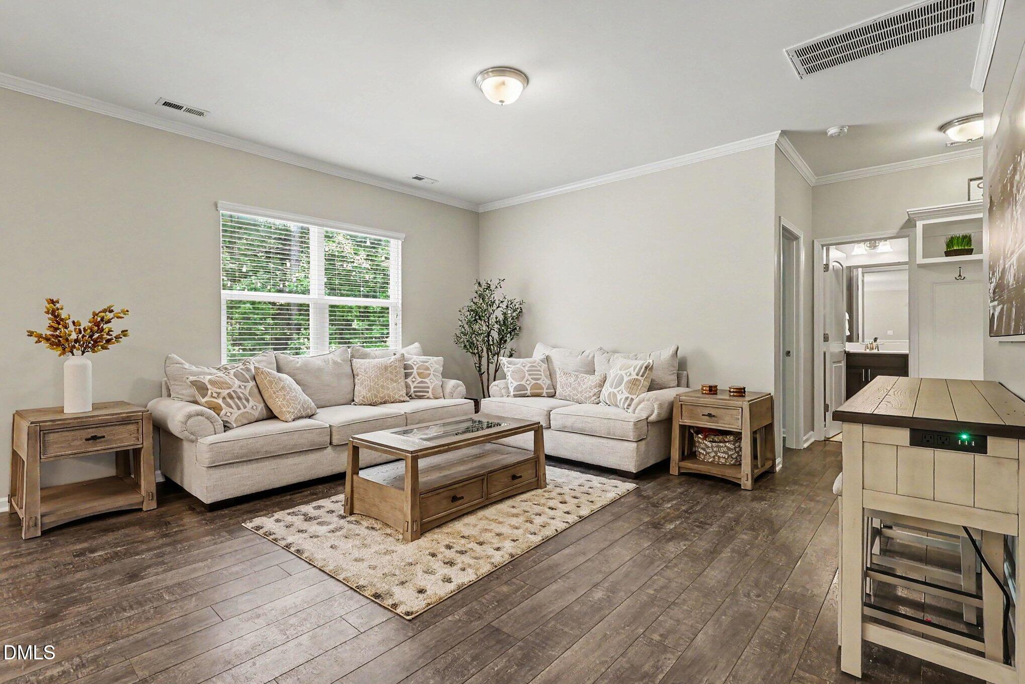 4366 Auburn Hills Drive Raleigh, NC 27616 - Photo 5 of 40 a living room with furniture and a fireplace