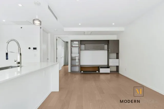 a view of room with kitchen