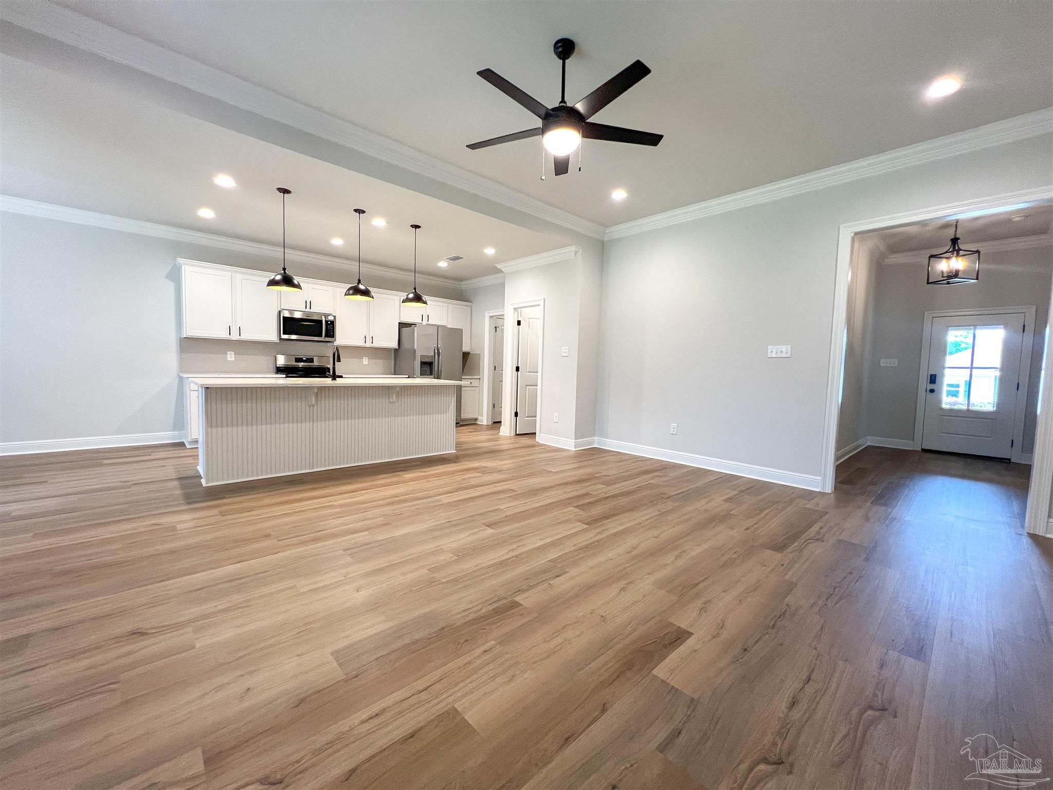 4605 Sago Palm Circle Milton, FL 32571 - Photo 2 of 33 a view of a kitchen with a sink and a stove top oven