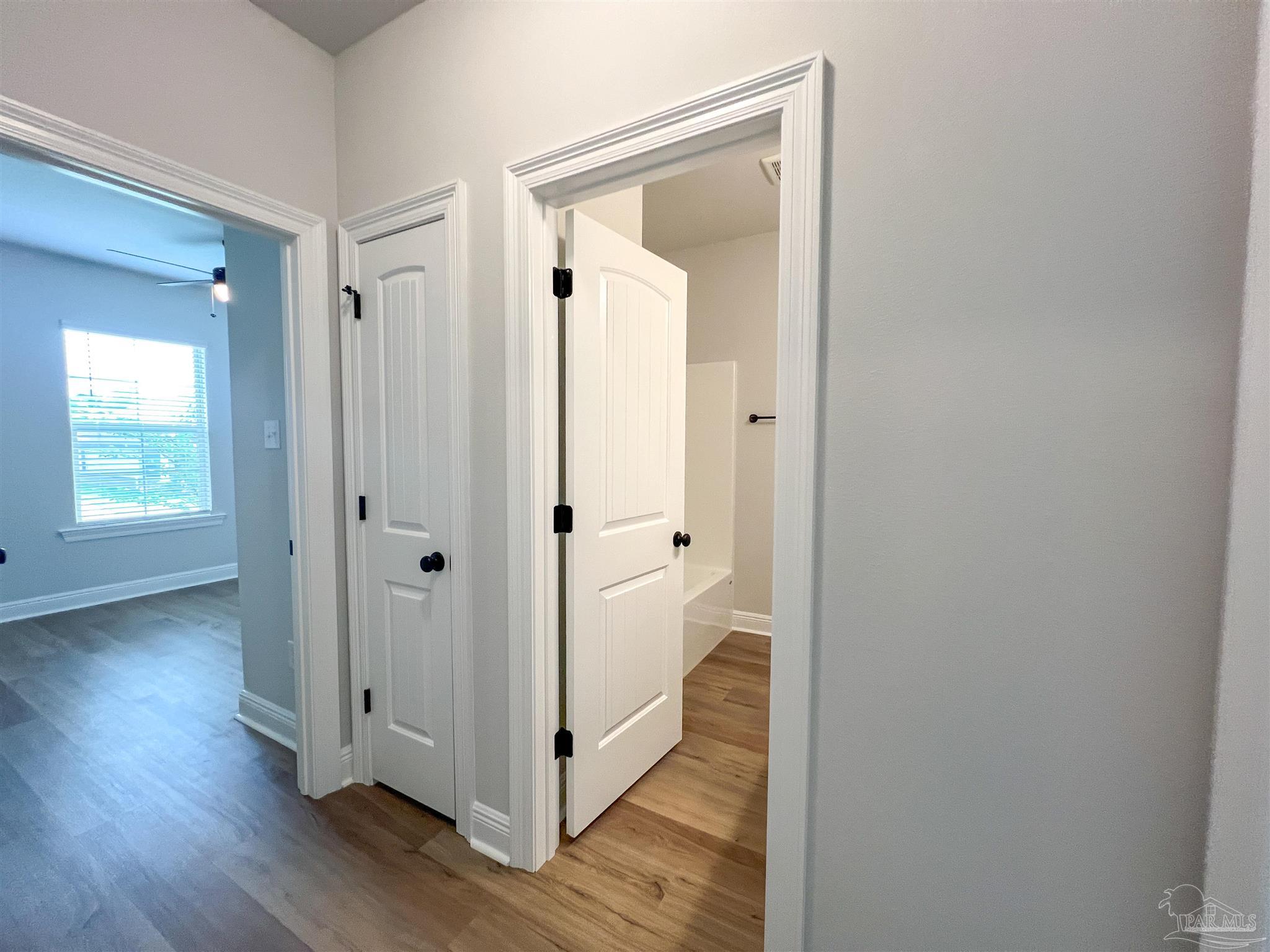 4605 Sago Palm Circle Milton, FL 32571 - Photo 23 of 33 a view of a bathroom with wooden floor