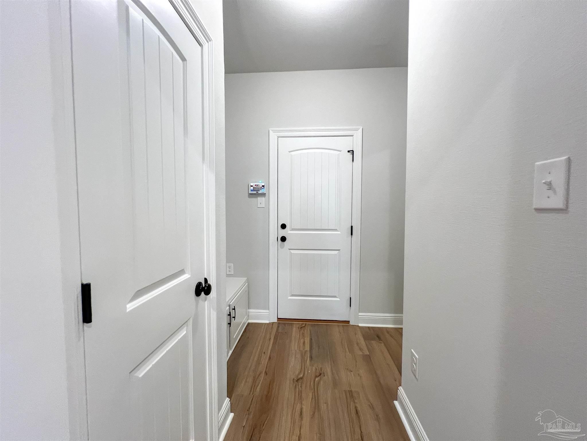 4605 Sago Palm Circle Milton, FL 32571 - Photo 10 of 33 a view of a room with wooden floor