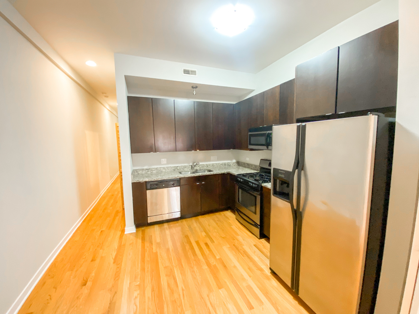 Undisclosed Address Chicago, IL 60612 - Photo 3 of 13 a kitchen with stainless steel appliances a refrigerator and a stove