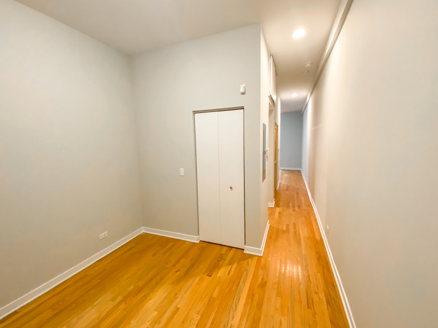 Undisclosed Address Chicago, IL 60612 - Photo 10 of 13 a view of a room with wooden floor and a ceiling fan