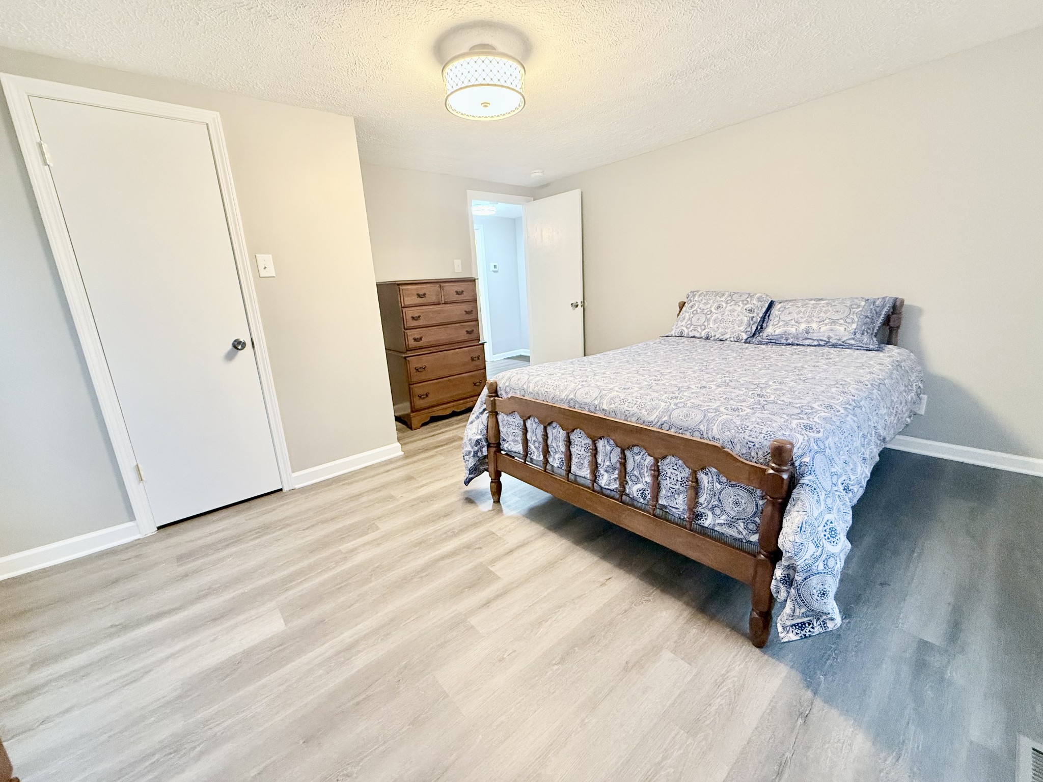 2210 Princeton Road Hopkinsville, KY 42240 - Photo 13 of 34 a bedroom with a bed and wooden floor