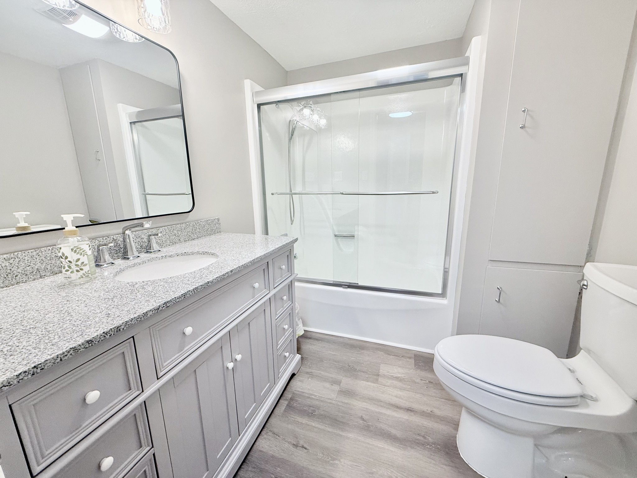 2210 Princeton Road Hopkinsville, KY 42240 - Photo 20 of 34 a bathroom with a granite countertop sink mirror vanity and toilet