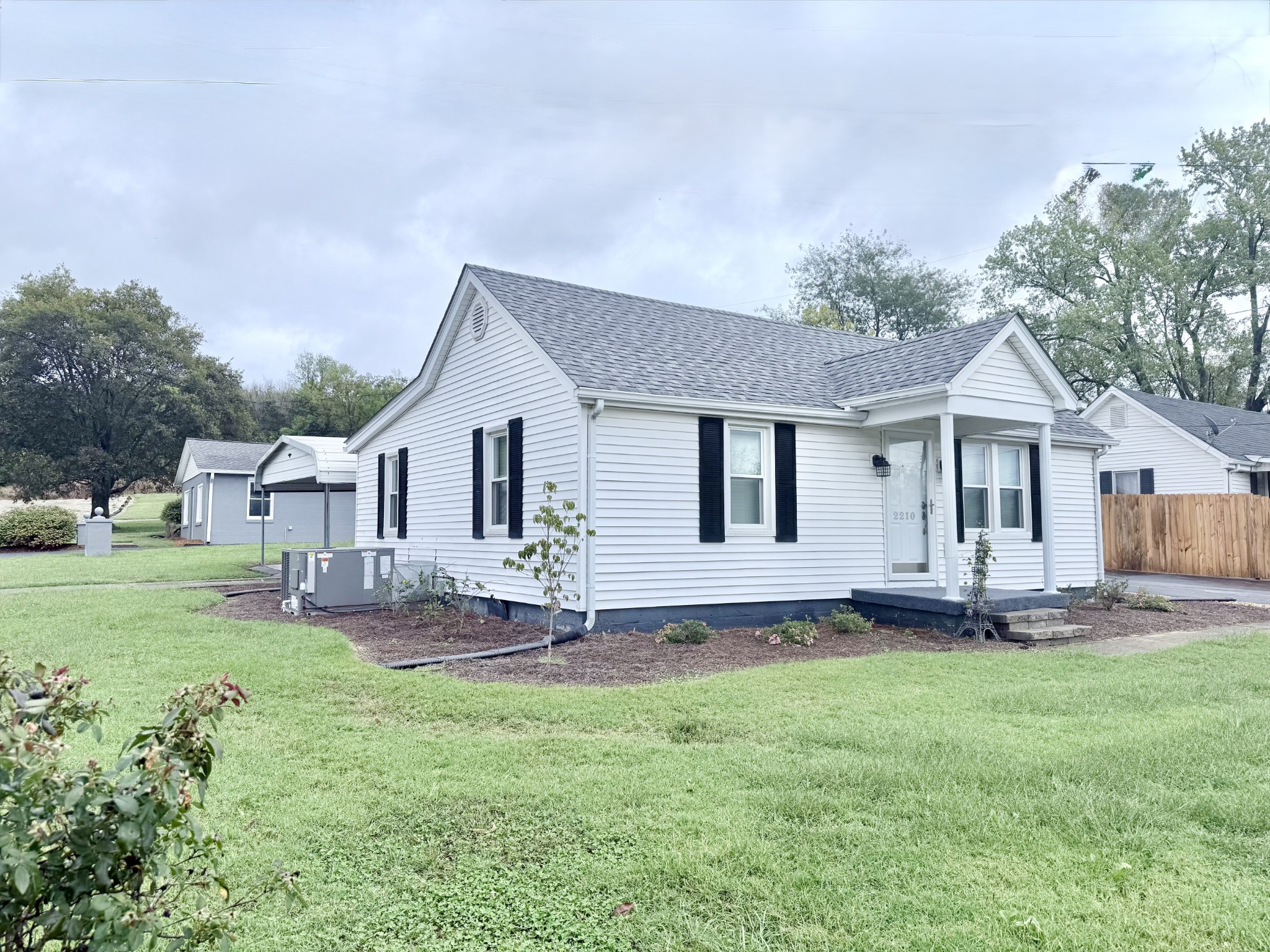 2210 Princeton Road Hopkinsville, KY 42240 - Photo 28 of 34 a front view of a house with a garden