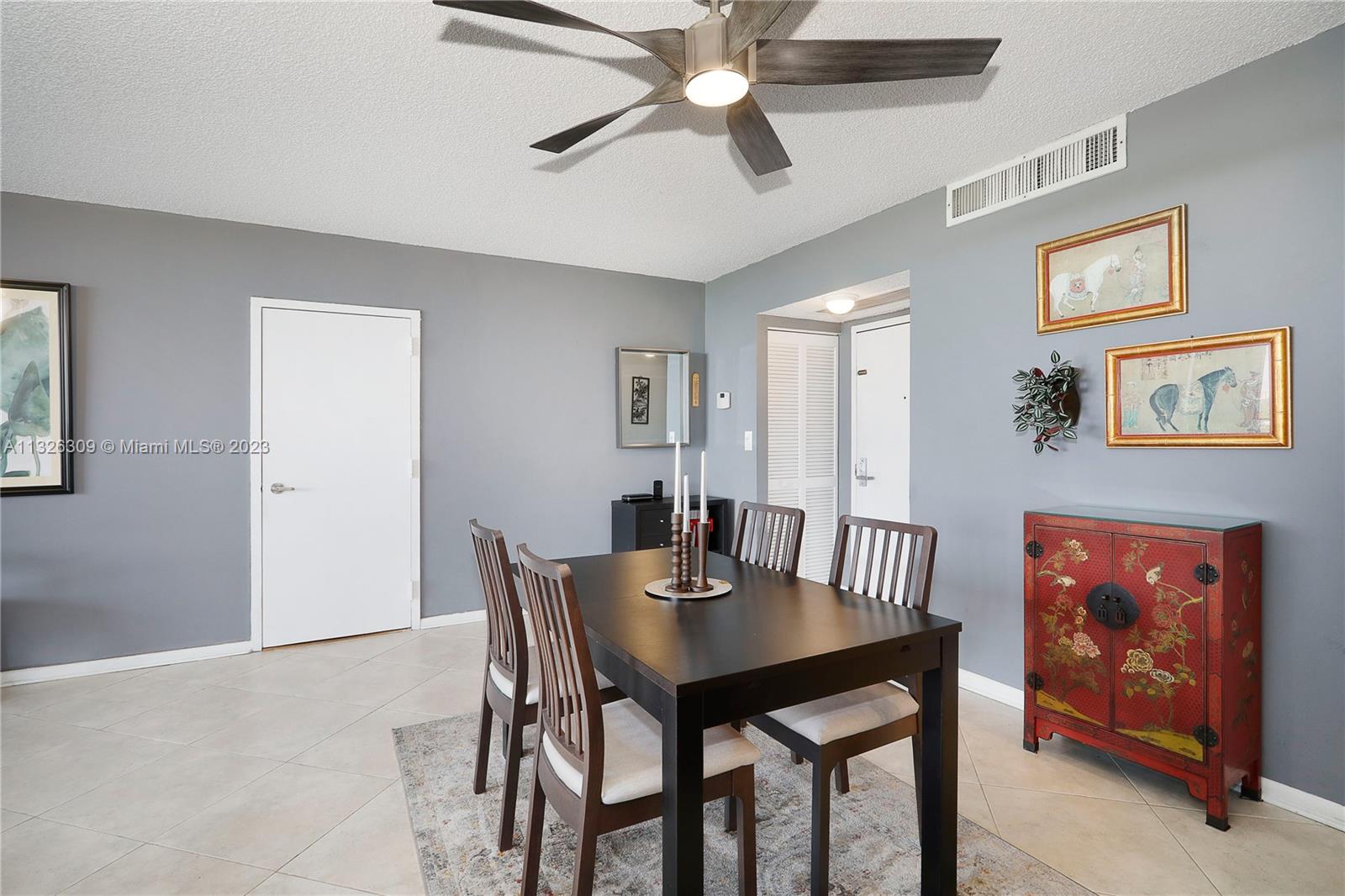 780 Northeast 69th Street, Unit 1004 Miami, FL 33138 - Photo 11 of 41 a view of a dining room with furniture