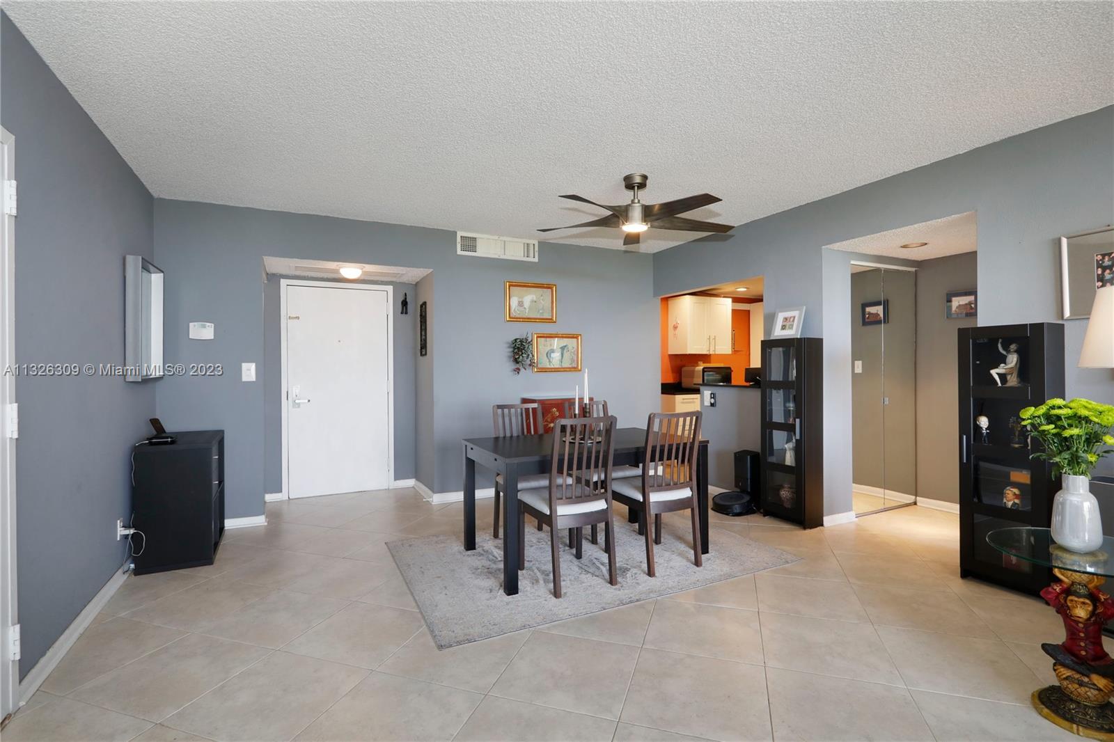 780 Northeast 69th Street, Unit 1004 Miami, FL 33138 - Photo 12 of 41 a view of a livingroom with furniture and a chandelier
