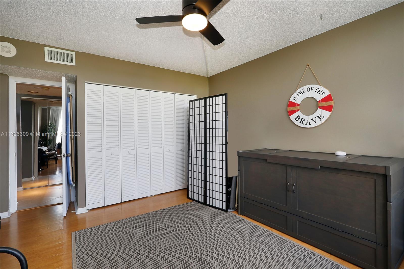 780 Northeast 69th Street, Unit 1004 Miami, FL 33138 - Photo 18 of 41 a view of an entryway and a chandelier fan