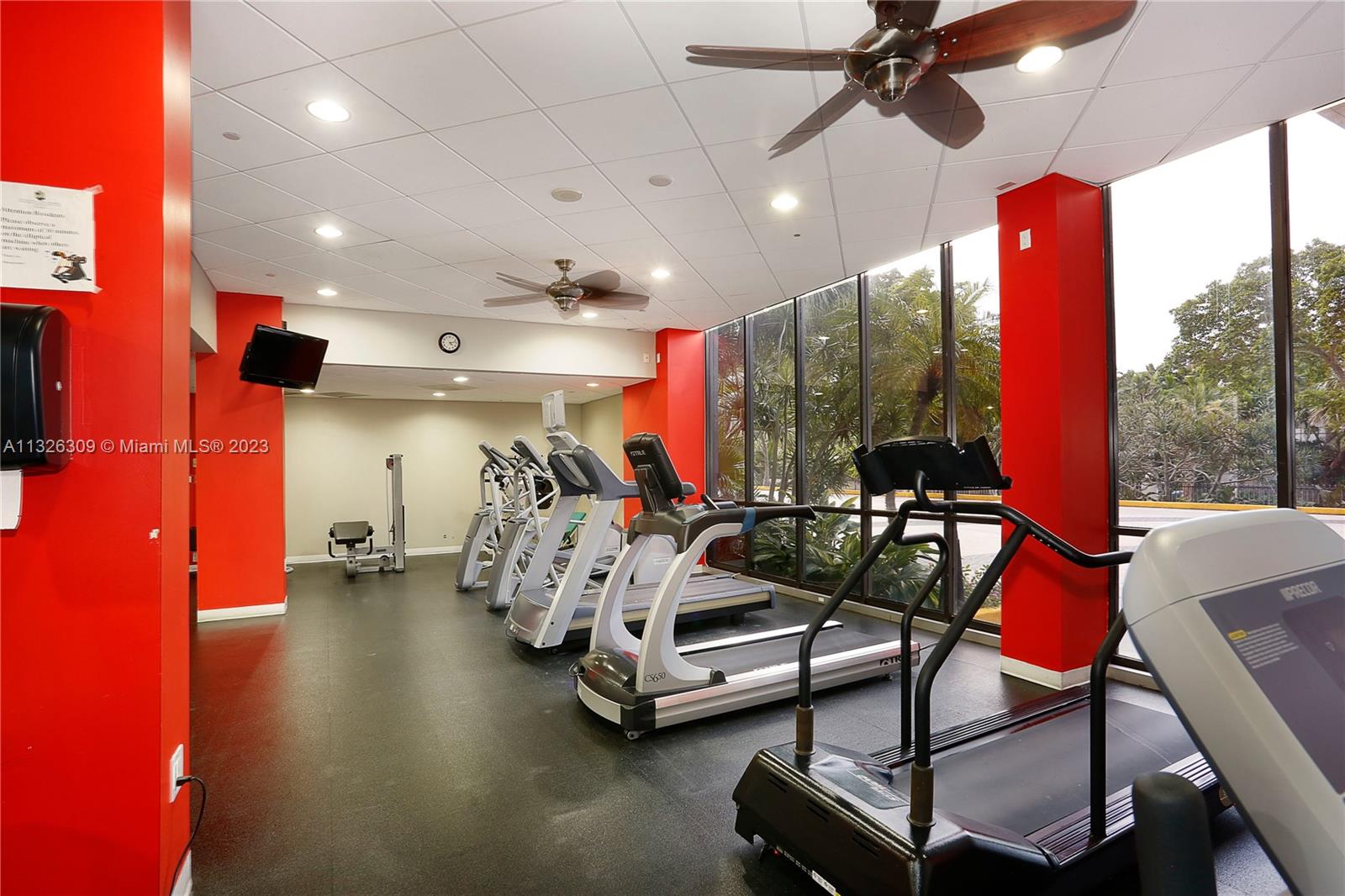 780 Northeast 69th Street, Unit 1004 Miami, FL 33138 - Photo 28 of 41 a view of a room with gym equipment