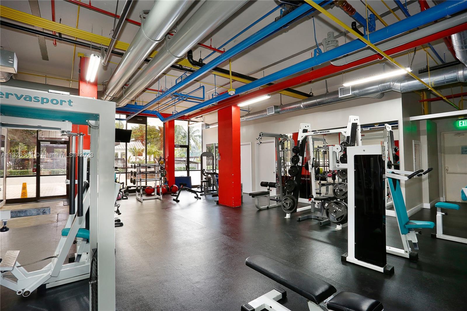 780 Northeast 69th Street, Unit 1004 Miami, FL 33138 - Photo 29 of 41 a view of a room with gym equipment