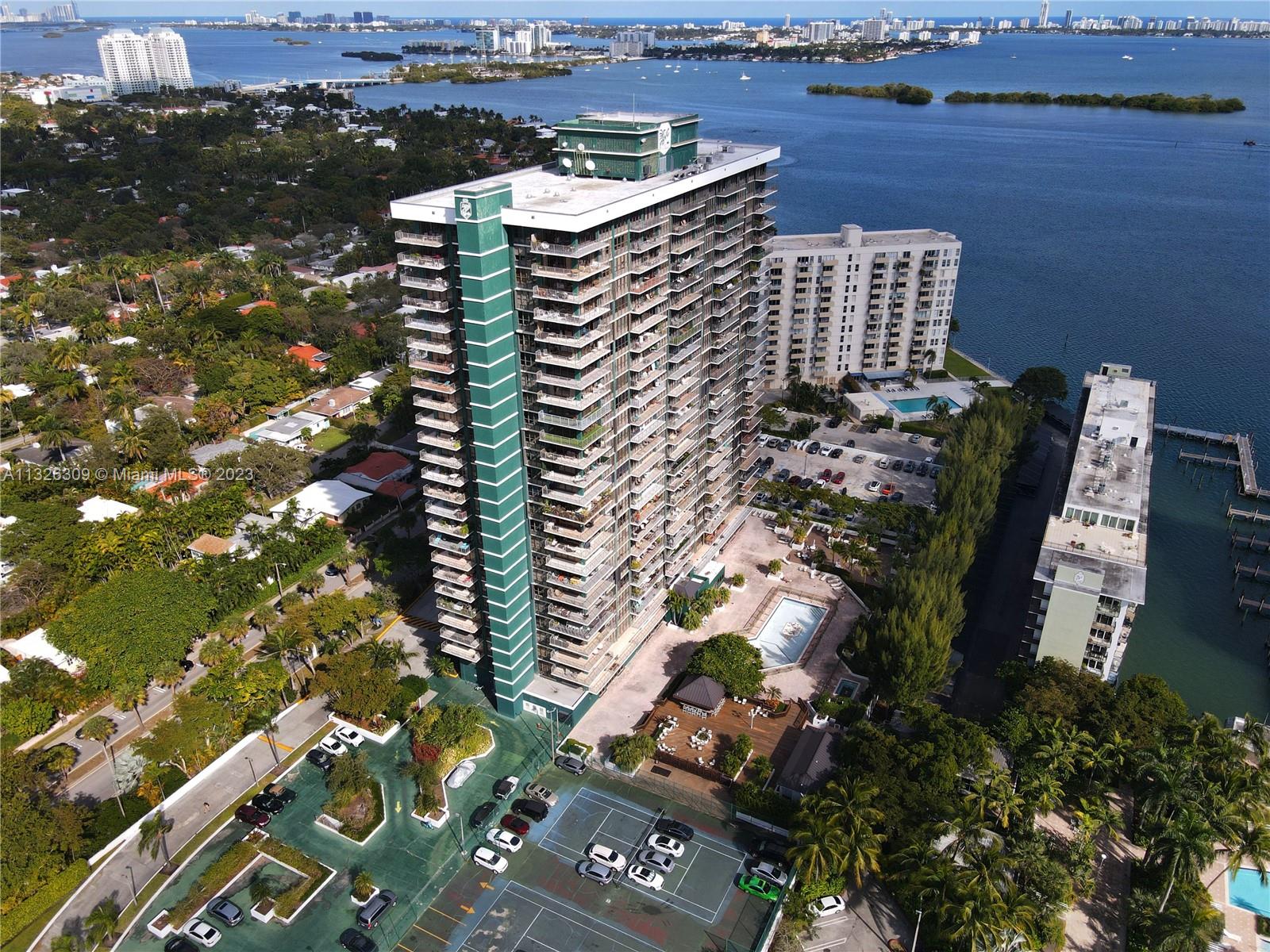 780 Northeast 69th Street, Unit 1004 Miami, FL 33138 - Photo 34 of 41 an aerial view of a residential apartment building with a yard