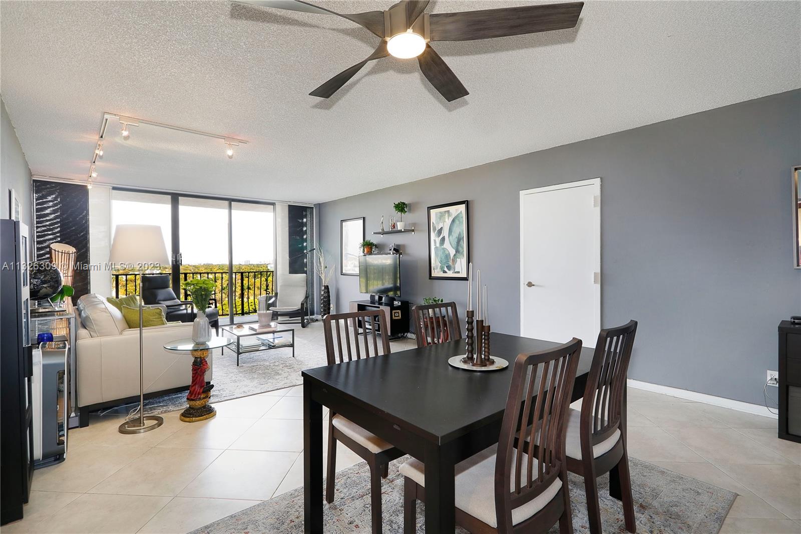 780 Northeast 69th Street, Unit 1004 Miami, FL 33138 - Photo 9 of 41 a view of a dining room with furniture window and outside view