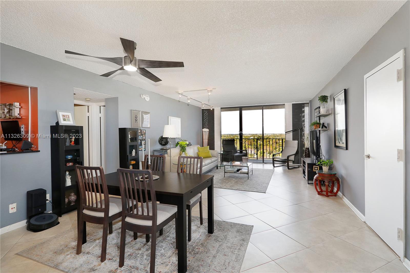 780 Northeast 69th Street, Unit 1004 Miami, FL 33138 - Photo 10 of 41 a view of a dining room with furniture window and outside view