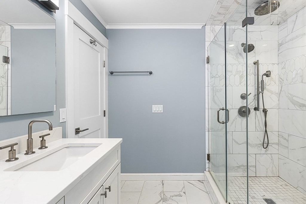 119 Highland Avenue, Unit B Somerville, MA 02143 - Photo 11 of 24 a bathroom with a sink and shower