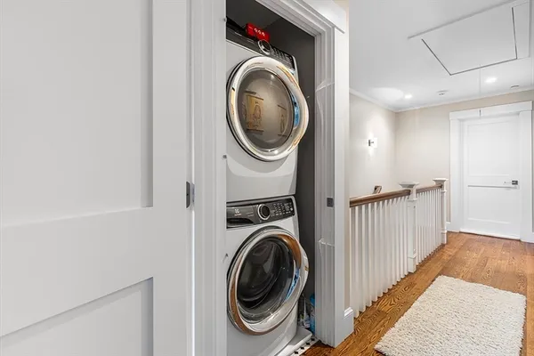 a view of a hallway with washer and dryer