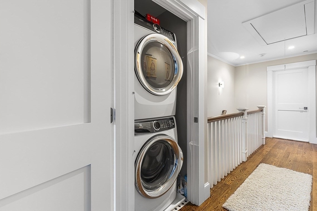 119 Highland Avenue, Unit B Somerville, MA 02143 - Photo 15 of 24 a view of a hallway with washer and dryer
