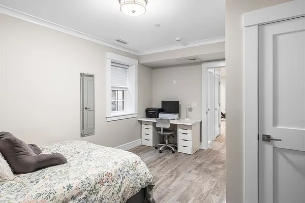 a bedroom with a workspace