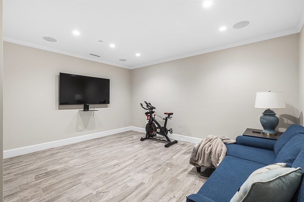 119 Highland Avenue, Unit B Somerville, MA 02143 - Photo 17 of 24 a living room with furniture and a flat screen tv
