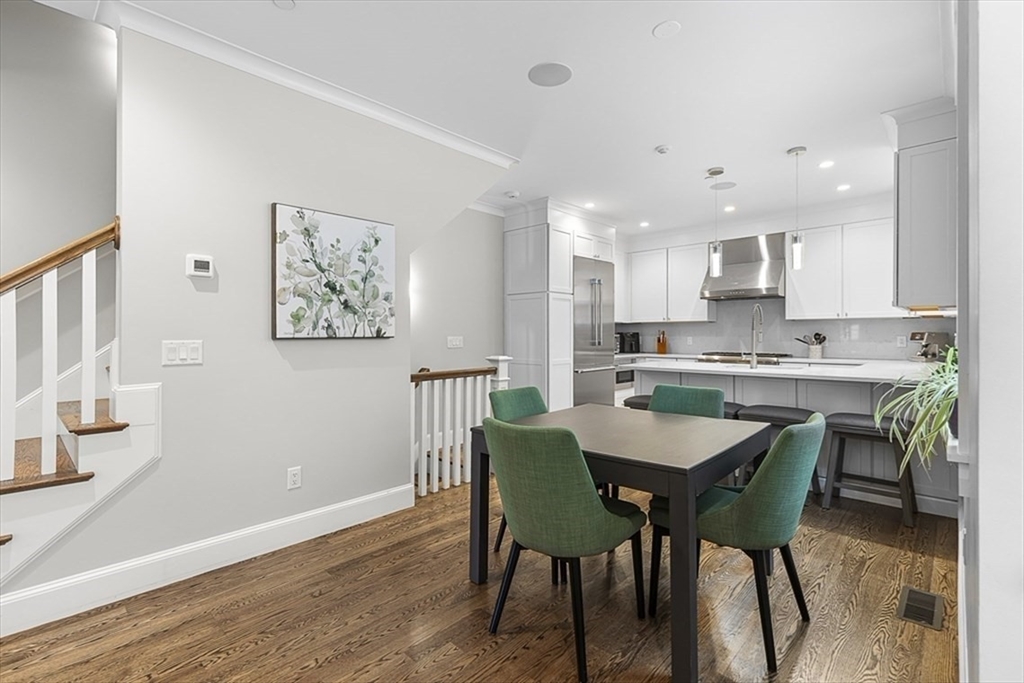 119 Highland Avenue, Unit B Somerville, MA 02143 - Photo 3 of 24 a view of a dining room with furniture and wooden floor